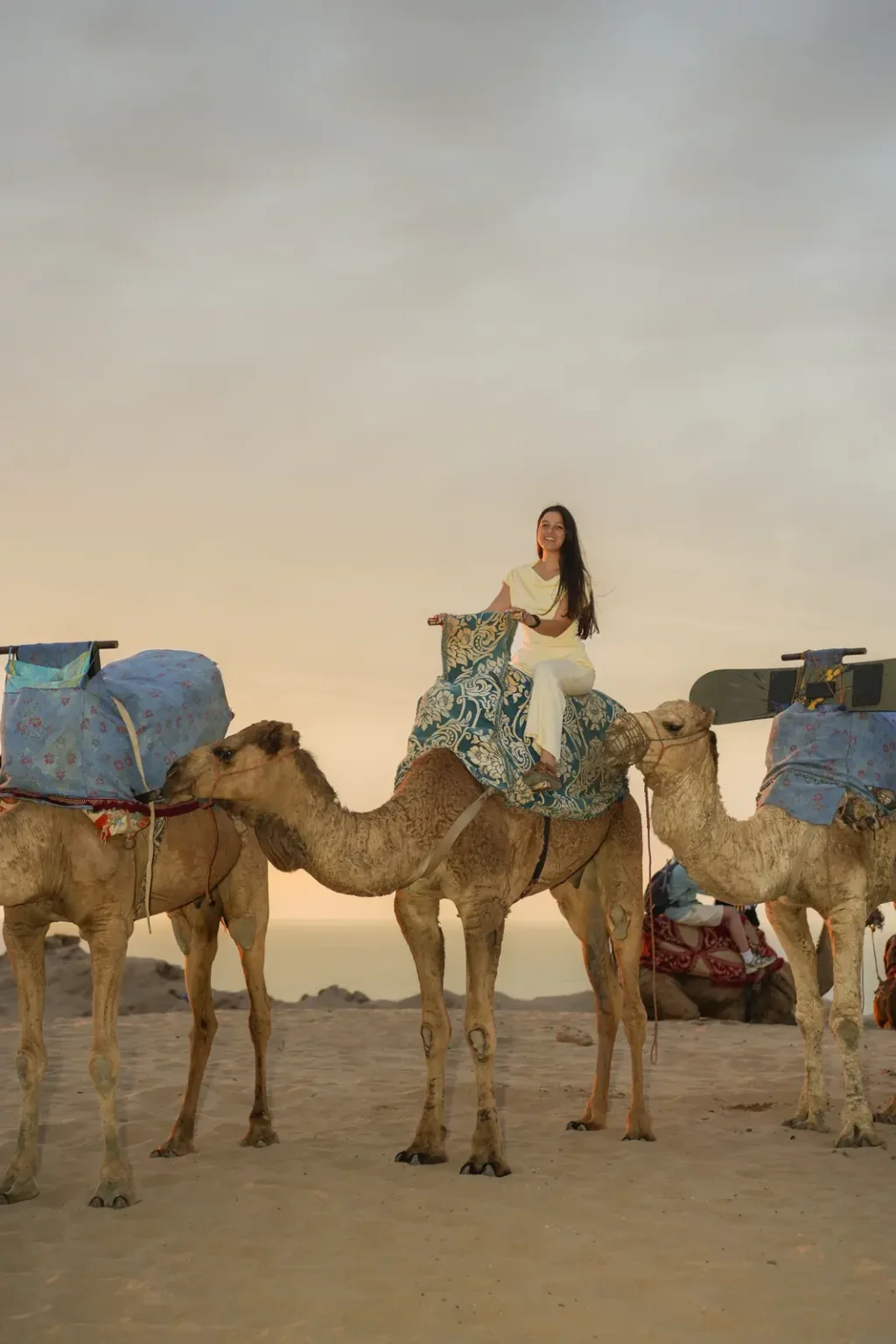 Rider on a camel in a caravan in the Timlalin dunes