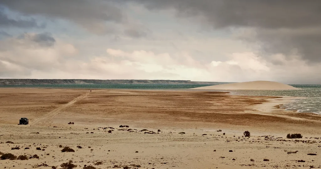 Coastal sand dunes and a wide sandy shore by the Atlantic in Morocco